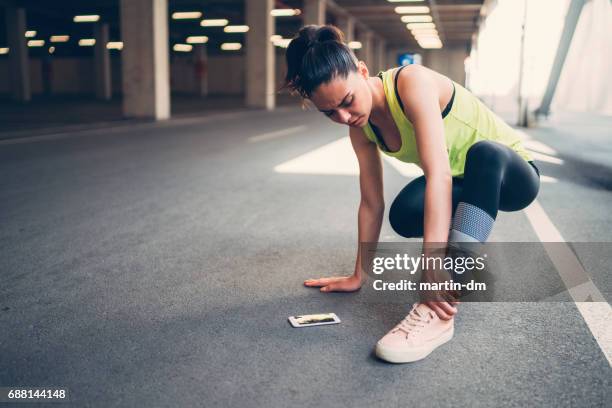 sportswoman with injured ankle - sprain stock pictures, royalty-free photos & images