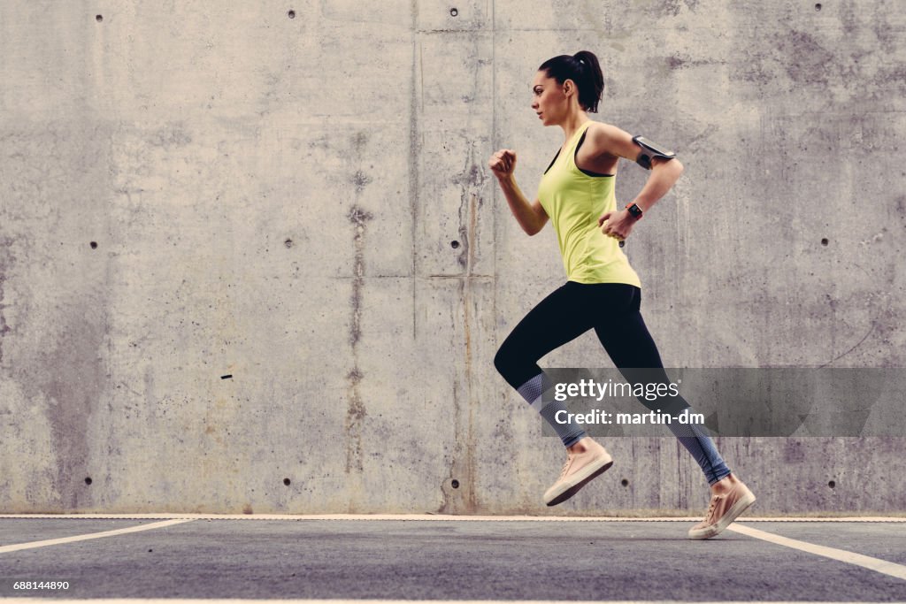 Young athlete jogging outside