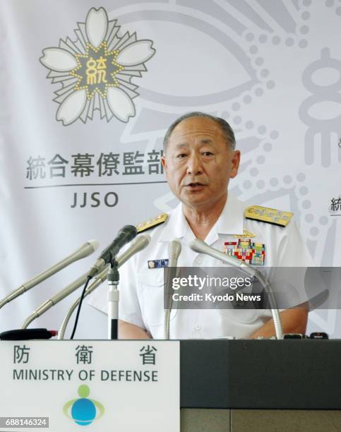 Adm. Katsutoshi Kawano, chief of the Self-Defense Forces Joint Staff, speaks at a press conference at the Defense Ministry in Tokyo on May 25, 2017....