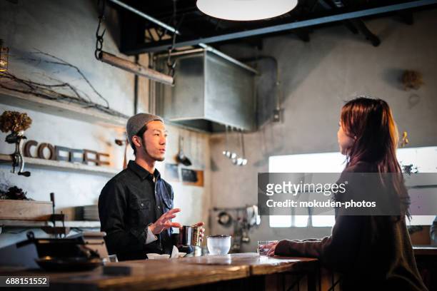 confident young male happy cafe owner - 真剣 stock pictures, royalty-free photos & images