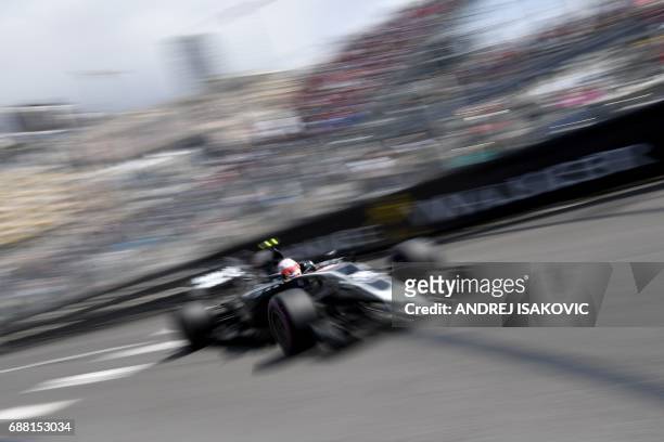 Haas F1's Danish driver Kevin Magnussen steers his car during the first practice session at the Monaco street circuit, on May 25, 2017 in Monaco,...