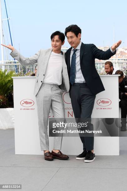 Actors Yim Si-wan and Sul Kyung-gu attend the "The Merciless" photocall during the 70th annual Cannes Film Festival at Palais des Festivals on May...