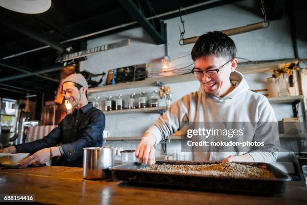 confident young males happy cafe owner - くつろぐ stock pictures, royalty-free photos & images