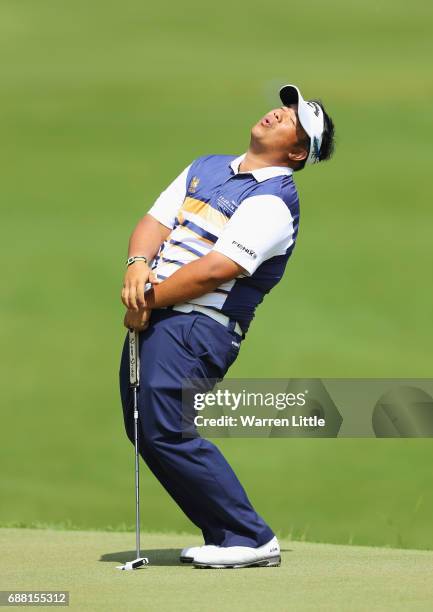 Kiradech Aphibarnrat of Thailand reacts on the 18th green during day one of the BMW PGA Championship at Wentworth on May 25, 2017 in Virginia Water,...