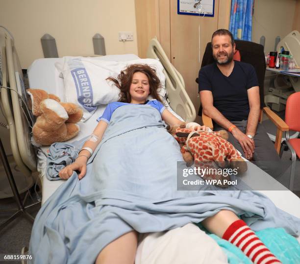 Evie Mills, 14 from Harrogate, a victim of Manchester Arena bombing with her dad, Craig as Queen Elizabeth II visits the Royal Manchester Children's...