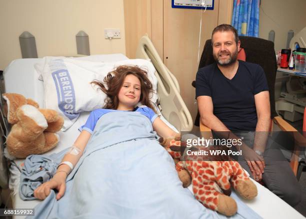 Evie Mills, 14 from Harrogate, a victim of Manchester Arena bombing with her dad, Craig as Queen Elizabeth II visits the Royal Manchester Children's...