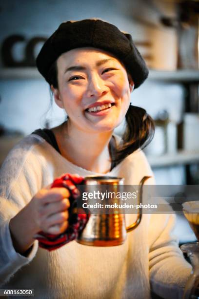happy japanese woman cafe owner - くつろぐ stock pictures, royalty-free photos & images