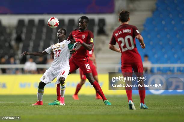 Krepin Diatta of Senegal and Derrick Jones of USA compete for the ball during the FIFA U-20 World Cup Korea Republic 2017 group F match between...