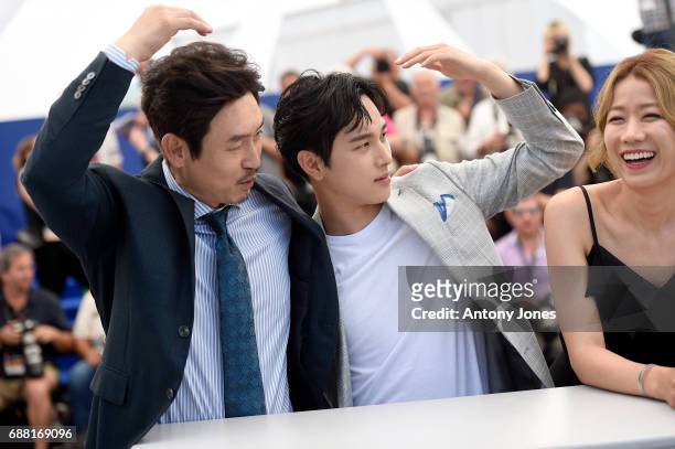 South Korean actor Sul Kyung-gu, South Korean actor Yim Si-wan and South Korean actress Jeon Hye-jin attend the "The Merciless" photocall during the...