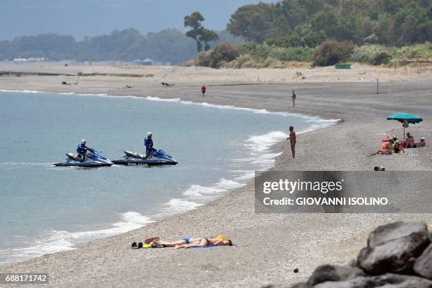 Italian police patrols with jetski along the beach near the Media Center of the G7 in the coastal town of Giardini Naxos, south of Taormina, on May...