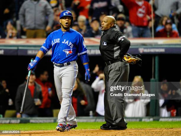 Firstbaseman Edwin Encarnacion of the Toronto Blue Jays argues a strike call with home plate umpire Laz Diaz, after striking out looking in the...