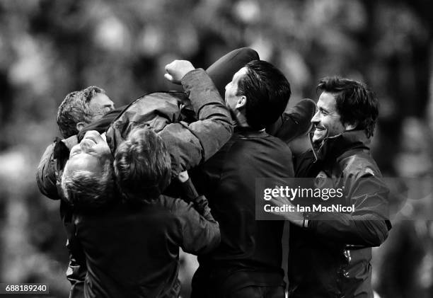 Manchester United manager Jose Mourinho is lifted up by back room staff during the UEFA Europa League Final match between Ajax and Manchester United...