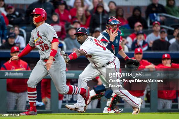 Adonis Garcia of the Atlanta Braves gets a tag out against the St. Louis Cardinals at SunTrust Park on May 05, 2017 in Atlanta, Georgia. The...