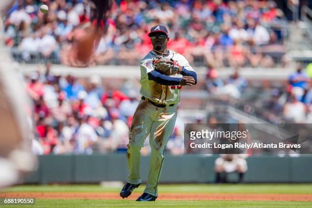 Adonis Garcia of the Atlanta Braves throws to first base against the St. Louis Cardinals at SunTrust Park on May 7, 2017 in Atlanta, Georgia. The...