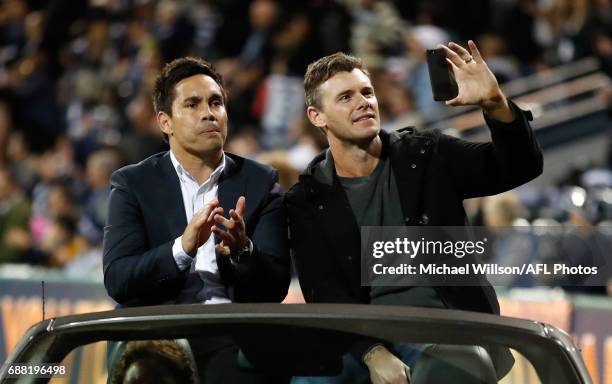 Mathew Stokes and Cameron Mooney complete a lap of honour celebrating the 10 year anniversary of the Cats 2007 premiership during the 2017 AFL round...