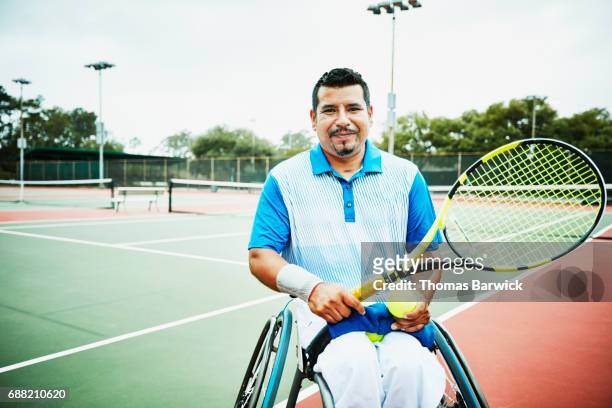 Portrait of adaptive athlete preparing to play wheelchair tennis
