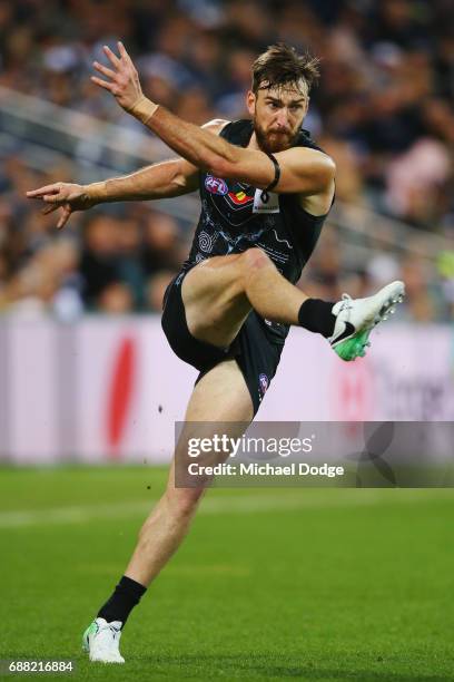 Charlie Dixon of the Power kicks the ball during the round ten AFL match between the Geelong Cats and the Port Adelaide Power at Simonds Stadium on...