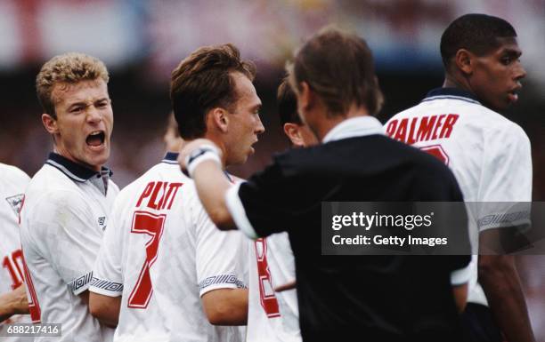 Alan Shearer reacts as referee Sándor Puhl directs the defensive wall as David Platt and Carlton Palmer look on during the 1992 UEFA European...