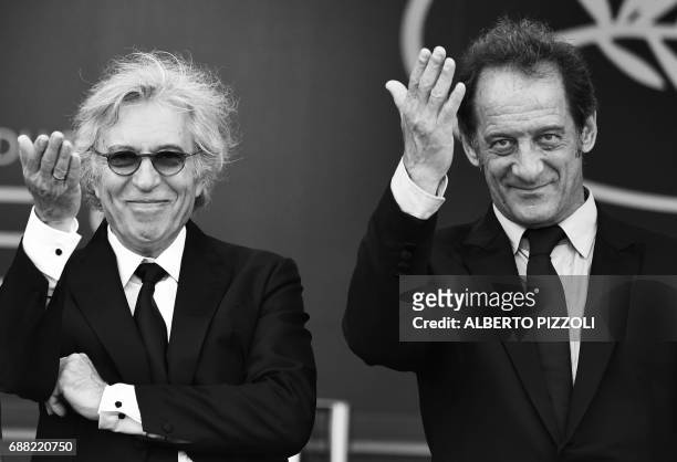 French director Jacques Doillon and French actor Vincent Lindon gesture as they arrive on May 24, 2017 for the screening of the film 'Rodin' at the...