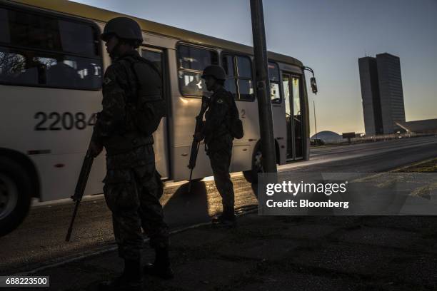 Federal army soldiers patrol the streets near the National Congress building in Brasilia, Brazil, on Thursday, May 25, 2017. President Michel Temer...