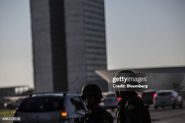 Federal army soldiers patrol the streets near the National Congress building in Brasilia, Brazil, on Thursday, May 25, 2017. President Michel Temer...