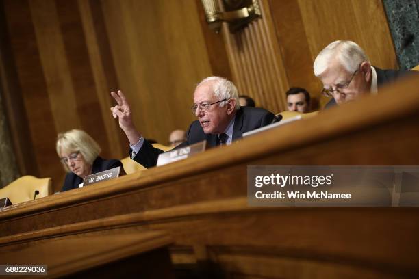 Sen. Bernie Sanders , ranking member of the Senate Budget Committee, questions Office of Management and Budget Director Mick Mulvaney during a...