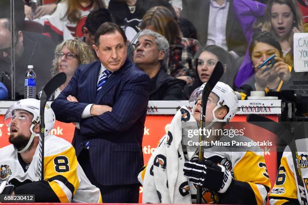 Assistant coach Jacques Martin of the Pittsburgh Penguins looks on against the Ottawa Senators in Game Six of the Eastern Conference Final during the...