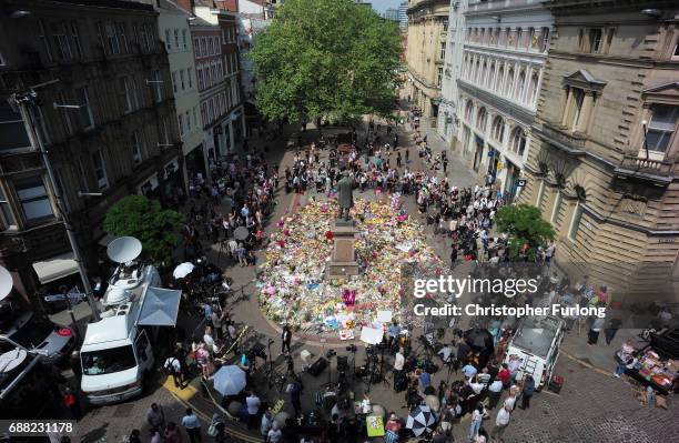 The carpet of floral tributes to the victims and injured of the Manchester Arena bombing covers the ground in St Ann's Square on May 25, 2017 in...