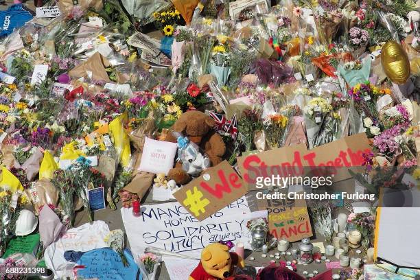 The carpet of floral tributes to the victims and injured of the Manchester Arena bombing covers the ground in St Ann's Square on May 25, 2017 in...