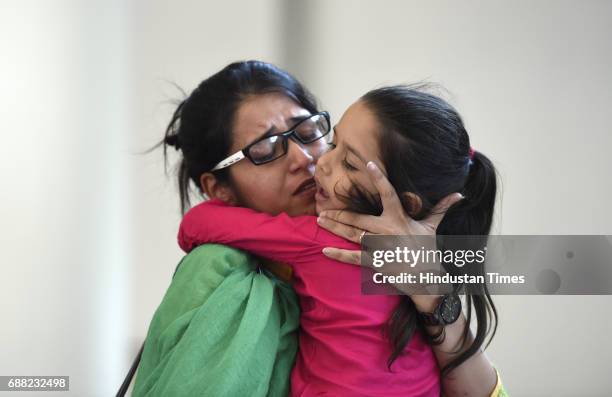 Uzma Ahmed hugs her daughter during her meeting with External Minister Sushma Swaraj at Jawahar Bhawan after returning from Pakistan on May 25, 2017...