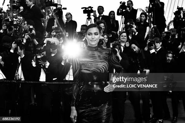 Russian model Irina Shayk poses as she arrives on May 24, 2017 for the screening of the film 'The Beguiled' at the 70th edition of the Cannes Film...