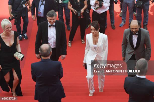 President of the Cannes Film Festival Pierre Lescure and General Delegate of the Cannes Film Festival Thierry Fremaux greet Danish producer Marianne...