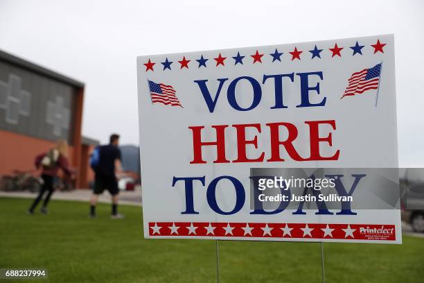 Sign is posted outside of a polling station at Hellgate Elementary School on May 25, 2017 in Missoula, Montana. Montanans are heading to the polls to...