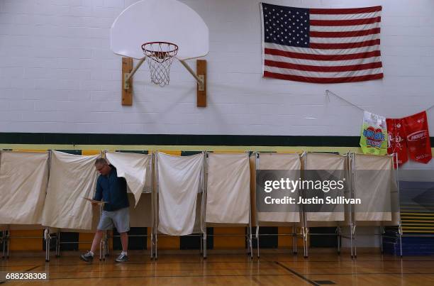 Voter exits a voting booth in a polling station at Hellgate Elementary School on May 25, 2017 in Missoula, Montana. Montanans are heading to the...