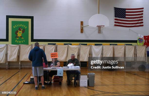 Voter registers in a polling station at Hellgate Elementary School on May 25, 2017 in Missoula, United States. Montanans are heading to the polls to...