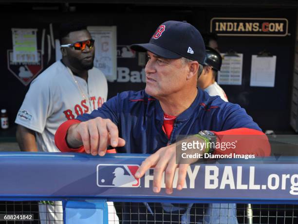 Manager John Farrell of the Boston Red Sox stands in the dugout during Game 2 of the American League Division Series against the Cleveland Indians on...