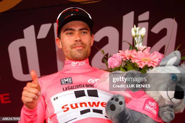 Netherlands' Tom Dumoulin of team Sunweb celebrates the Pink Jersey of the overall leader on the podium after the 18th stage of the 100th Giro...