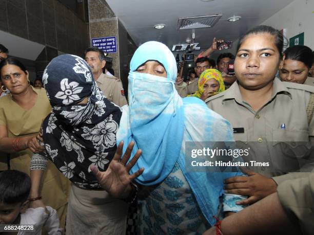 Gangrape victims escorted out of district hospital after conducting their medical test on May 25, 2017 in Noida, India. A gang of highway robbers...