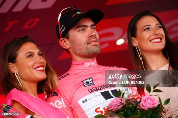 Netherlands' Tom Dumoulin of team Sunweb celebrates the Pink Jersey of the overall leader on the podium after the 18th stage of the 100th Giro...