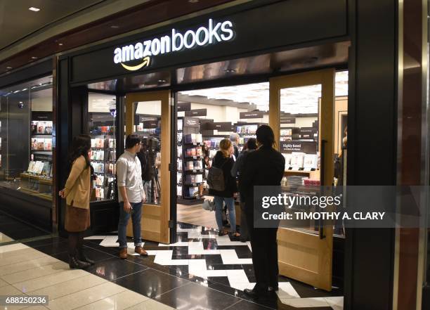 Customers arrive at Amazon Books in Manhattan's Time Warner Center on May 25, 2017 as the online retailing giant Amazon.com Inc. Opens its first New...