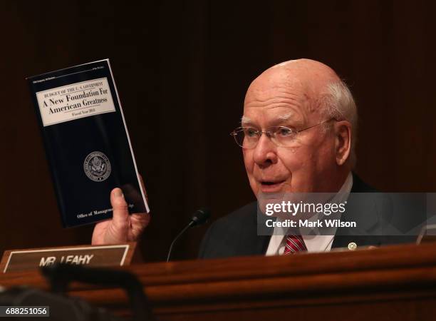 Sen. Patrick Leahy , holds a copy of President Trump's budget proposal while questioning Homeland Security Secretary John Kelly during a Senate...