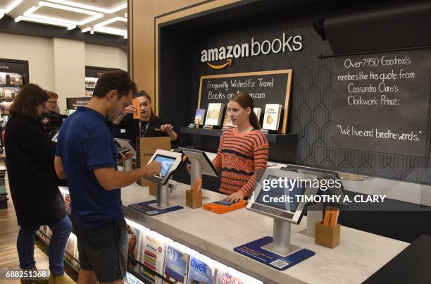 Customers arrive at Amazon Books in Manhattan's Time Warner Center on May 25, 2017 as the online retailing giant Amazon.com Inc. Opens its first New...