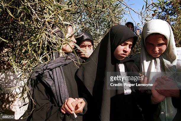 Palestinian girls mourn the death of Mohammed Houmeduk who was shot and killed by Israeli forces, December 18, 2001 during his funeral in Khan...