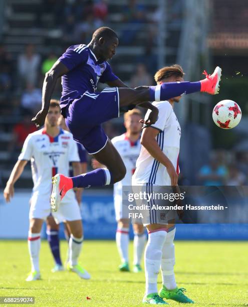 Abdoul Dante of RSC Anderlecht clears the ball as Amine Gouiri of Olympique Lyonnais closes in during the Final match between Olympique Lyon vs RSC...