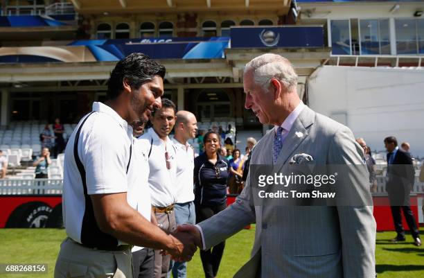 The Prince of Wales meets Kumar Sangakkara of Sri Lanka at the launch of the ICC Champions Trophy at The Oval on May 25, 2017 in London, England.