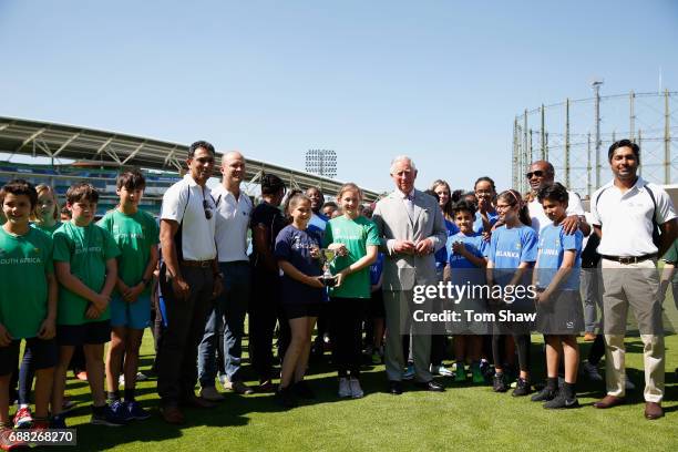 The Prince of Wales meets and greets kids at the launch of the ICC Champions Trophy at The Oval on May 25, 2017 in London, England.