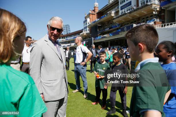 The Prince of Wales meets and greets kids at the launch of the ICC Champions Trophy at The Oval on May 25, 2017 in London, England.