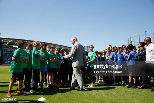 The Prince of Wales meets and greets kids at the launch of the ICC Champions Trophy at The Oval on May 25, 2017 in London, England.