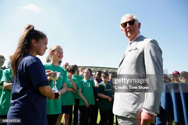 The Prince of Wales meets and greets kids at the launch of the ICC Champions Trophy at The Oval on May 25, 2017 in London, England.