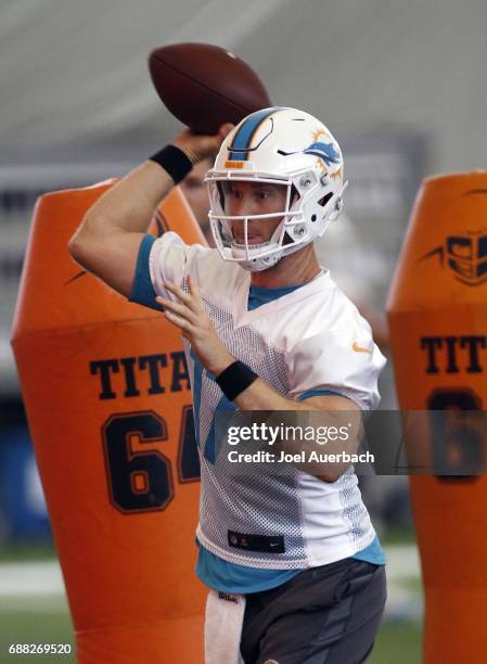 Ryan Tannehill of the Miami Dolphins throws the ball during the teams OTA's on May 25, 2017 at the Miami Dolphins training facility in Davie, Florida.